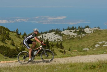 Mountain bikers in a long distance race with goal in Velebit, North Velebit National Park